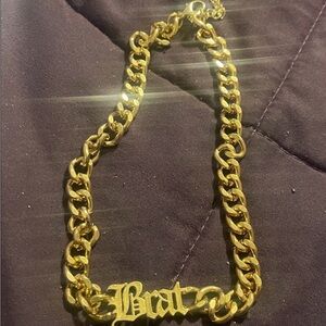 Gold colored Chain Necklace with 'Brat' Pendant